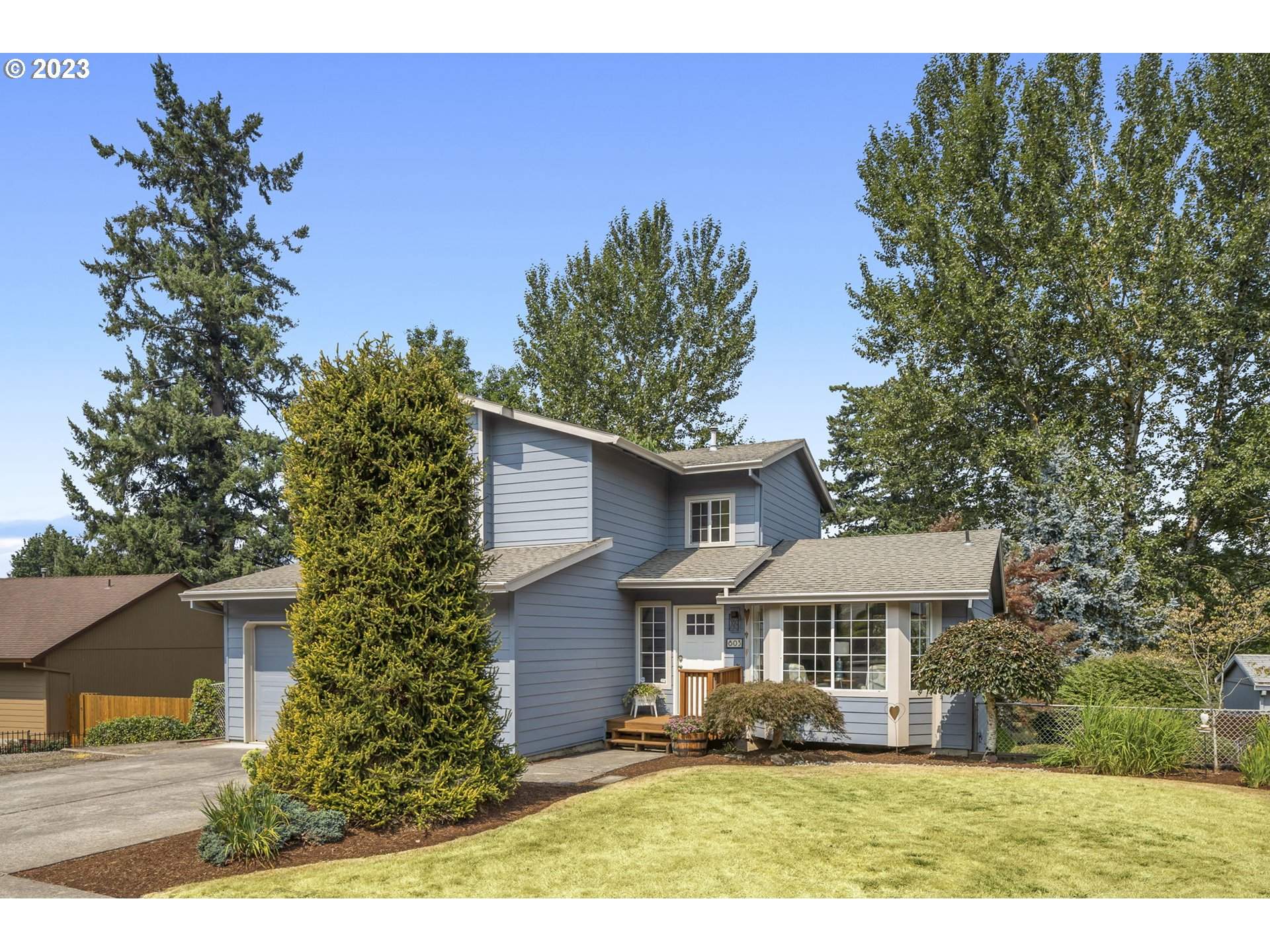 803 Southwest 4th Street Gresham, OR 97080 - Photo 2 of 42 a front view of a house with a yard