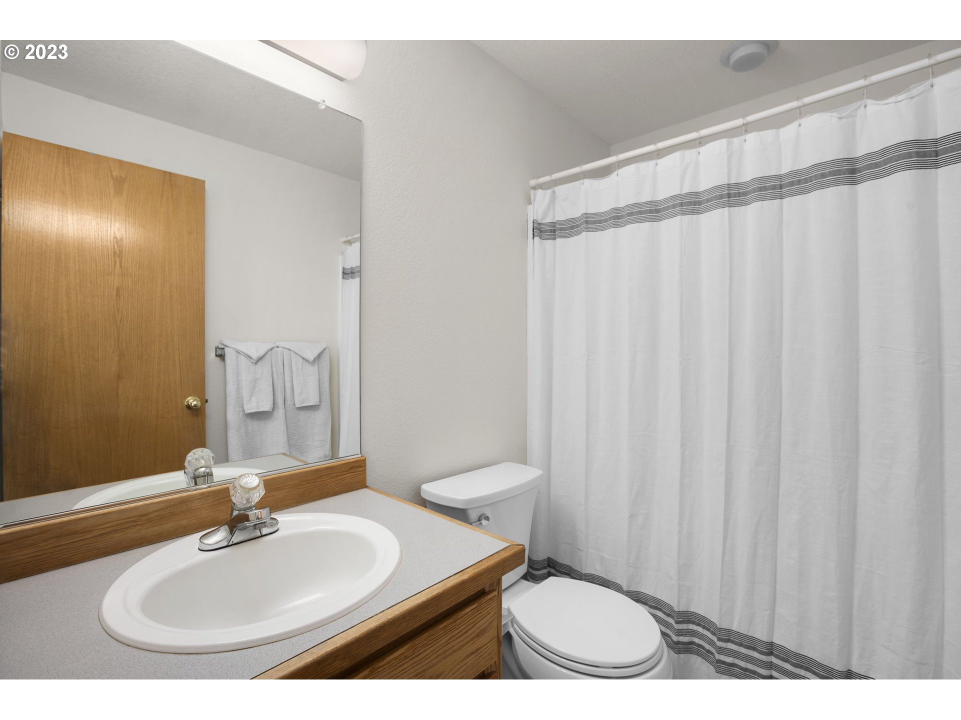 803 Southwest 4th Street Gresham, OR 97080 - Photo 23 of 42 a bathroom with a sink and a mirror