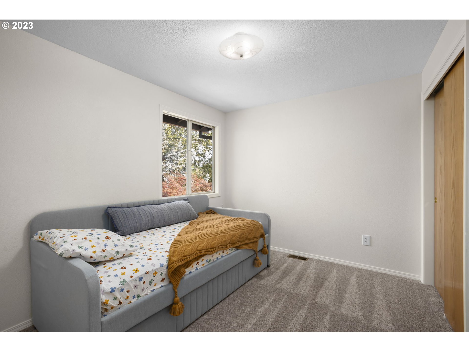 803 Southwest 4th Street Gresham, OR 97080 - Photo 24 of 42 a bedroom with a bed and window