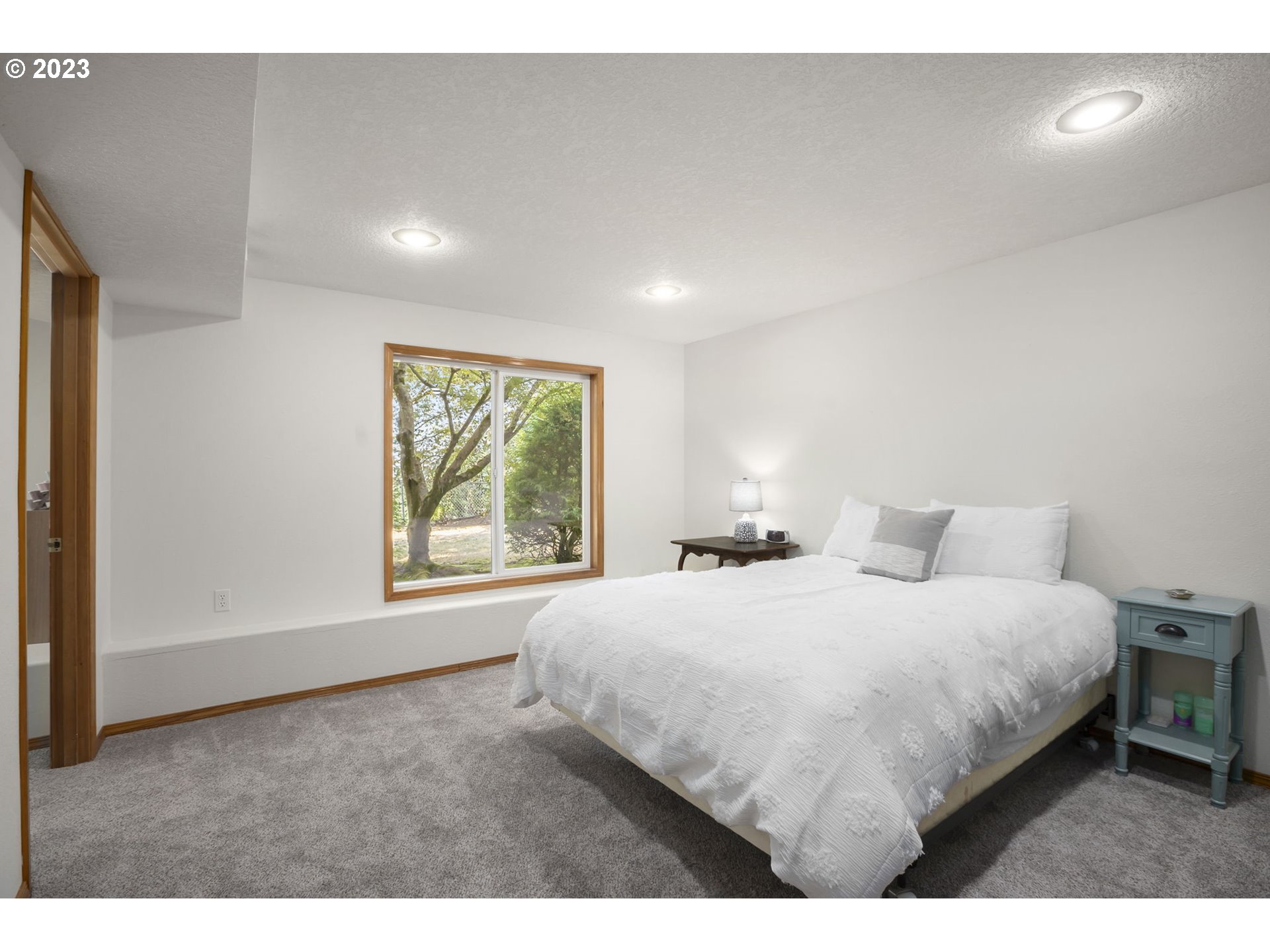 803 Southwest 4th Street Gresham, OR 97080 - Photo 26 of 42 a bedroom with a large bed and a window