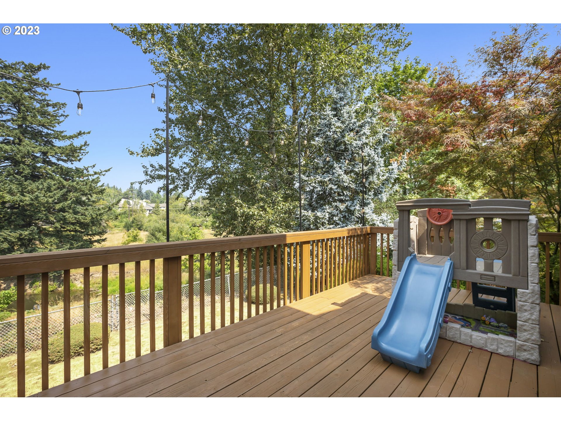 803 Southwest 4th Street Gresham, OR 97080 - Photo 30 of 42 a view of balcony with wooden floor and outdoor seating