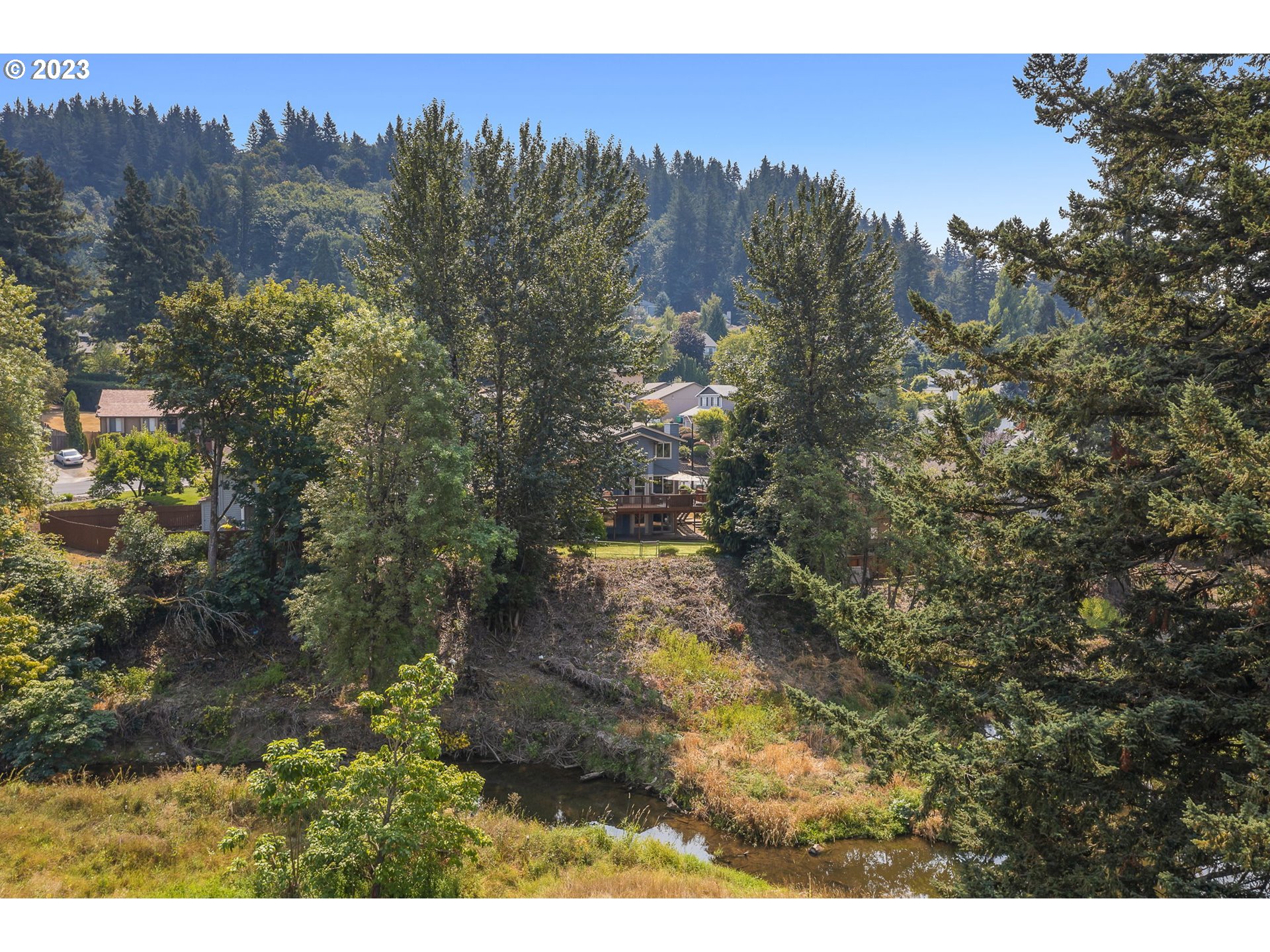 803 Southwest 4th Street Gresham, OR 97080 - Photo 35 of 42 a view of a city with lush green forest