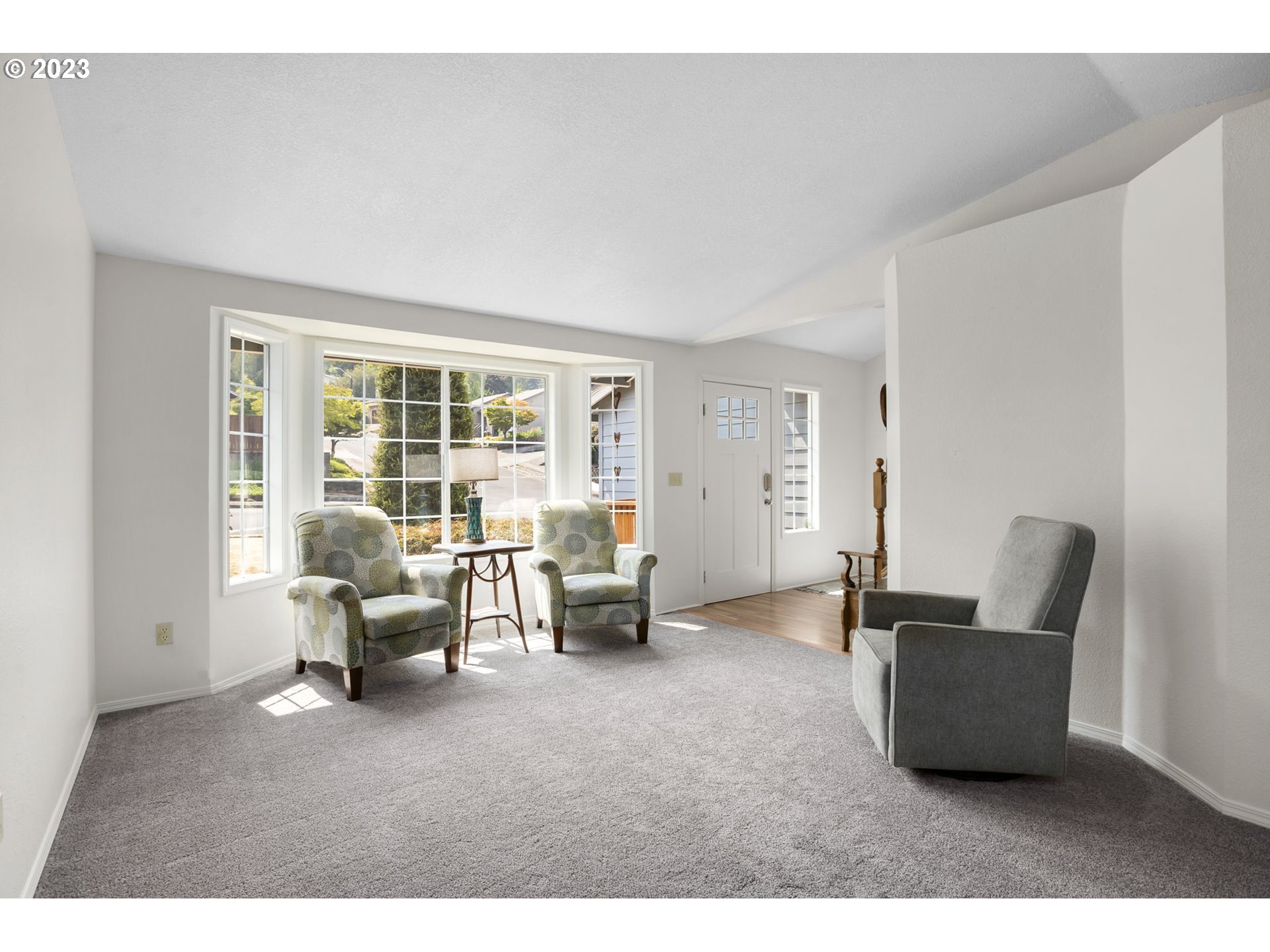 803 Southwest 4th Street Gresham, OR 97080 - Photo 7 of 42 a living room with furniture and large windows