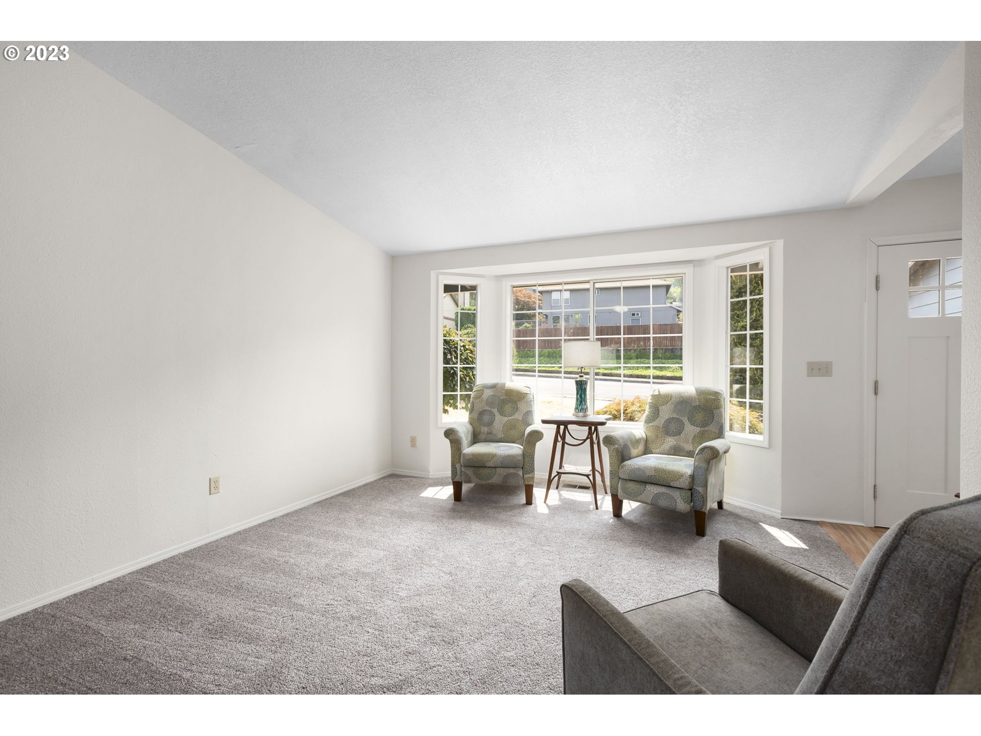 803 Southwest 4th Street Gresham, OR 97080 - Photo 8 of 42 a living room with furniture and a large window