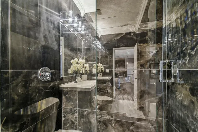 a view of a patio with swimming pool and green space