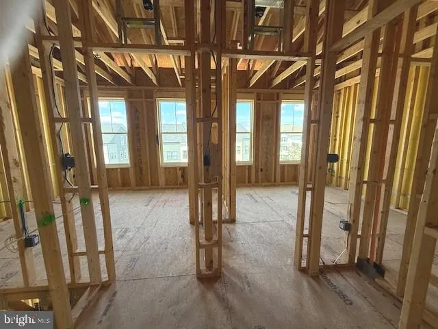 hallway with glass door and chandelier
