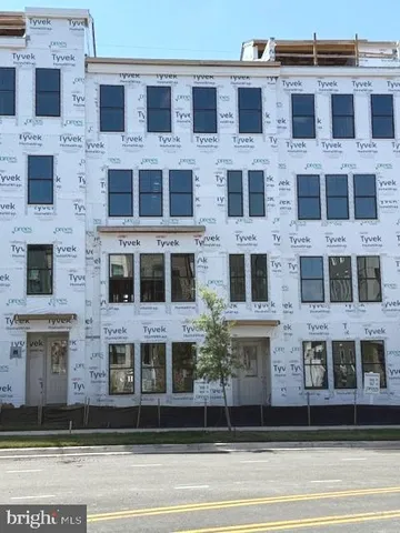 a view of a brick building with many windows