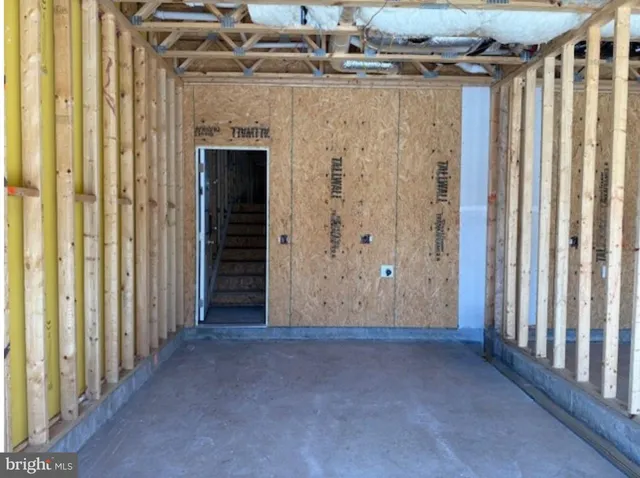 a view of a door with wooden walls
