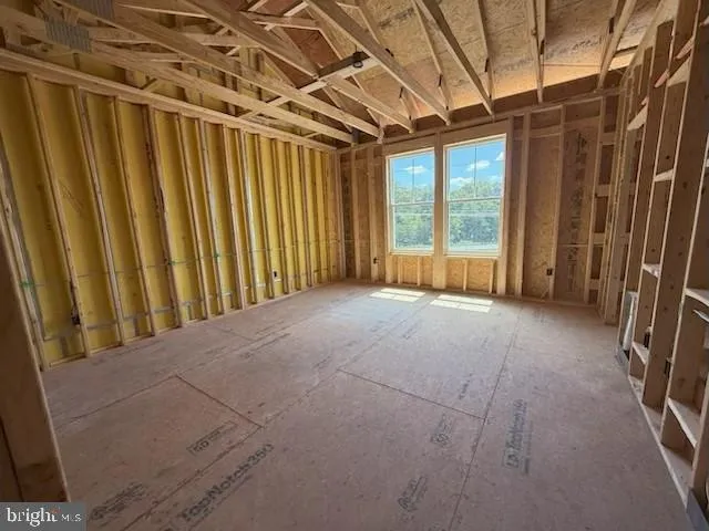 a view of a room with wooden walls