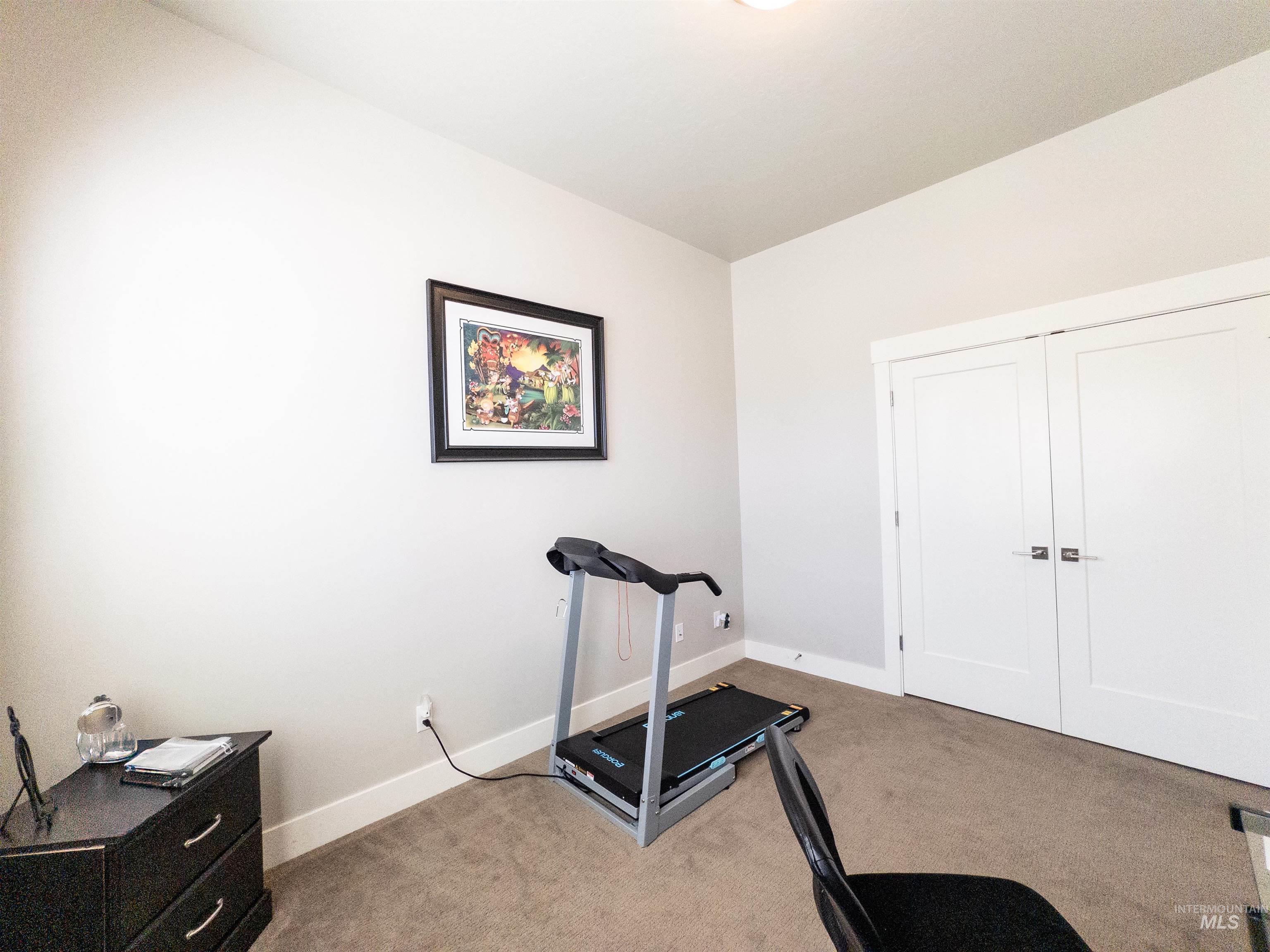 4577 North Comiso Place Meridian, ID 83646 - Photo 18 of 47 Exercise room featuring light colored carpet