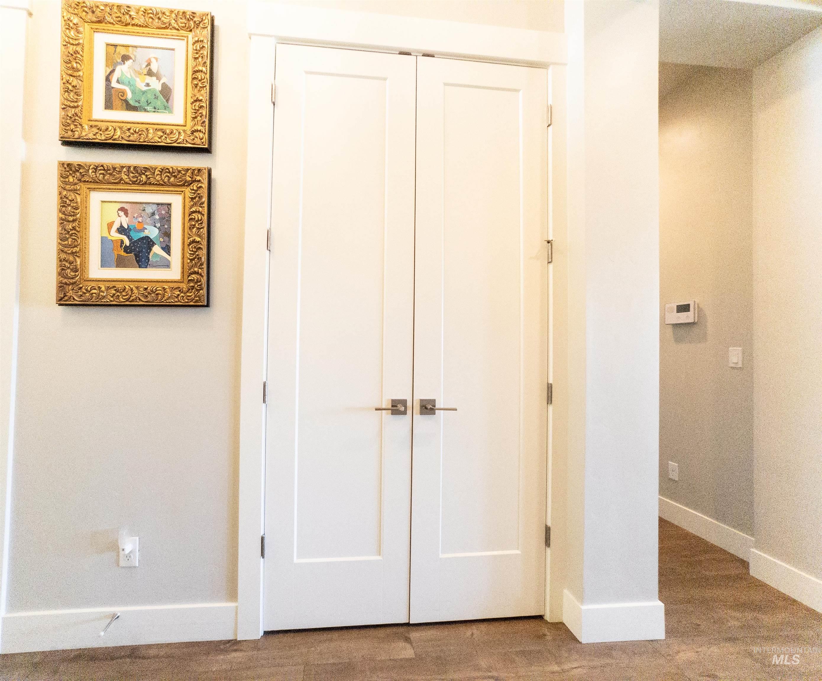 4577 North Comiso Place Meridian, ID 83646 - Photo 19 of 47 Hallway with baseboards and wood finished floors