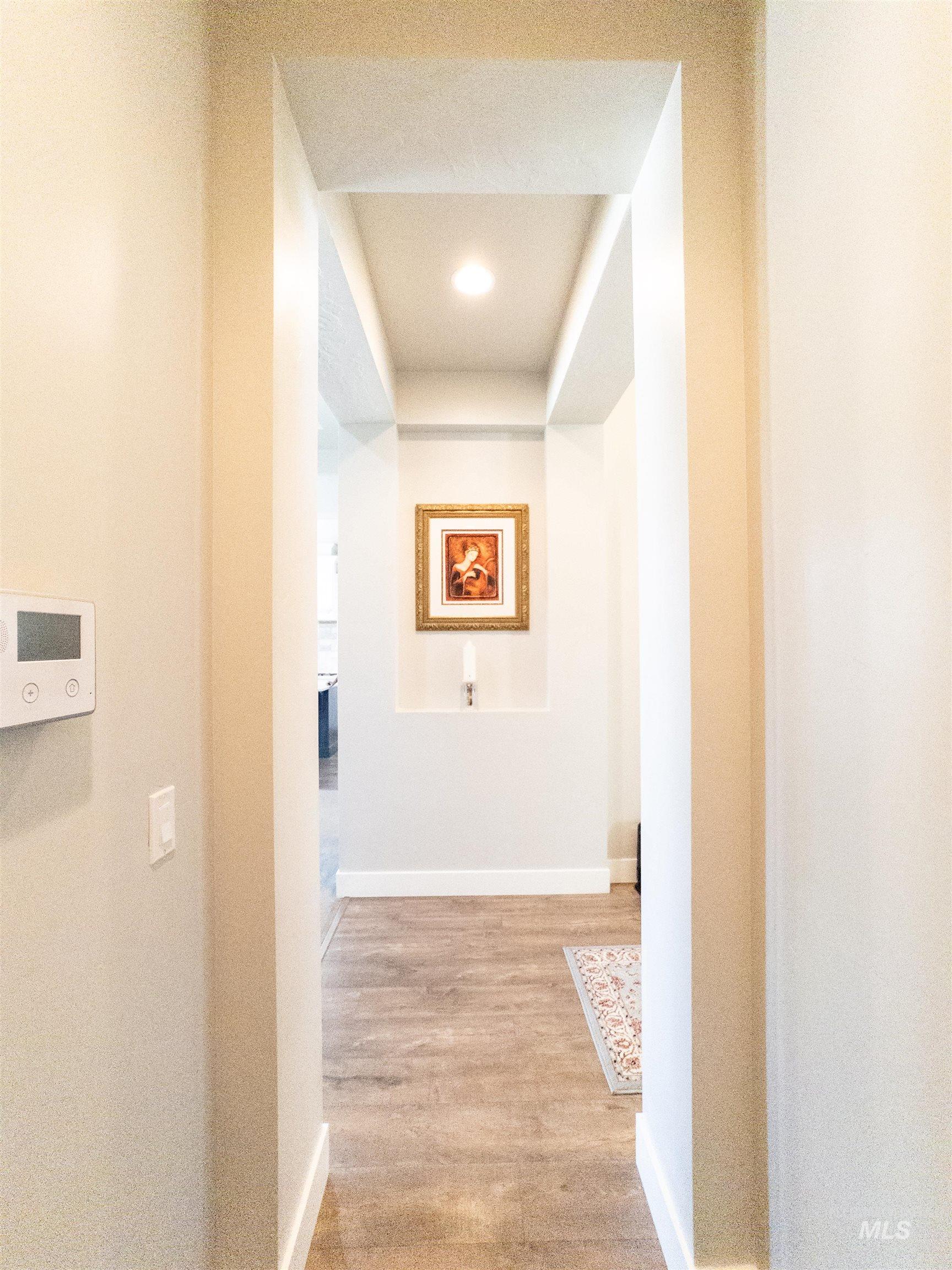 4577 North Comiso Place Meridian, ID 83646 - Photo 21 of 47 Corridor featuring light wood finished floors and recessed lighting