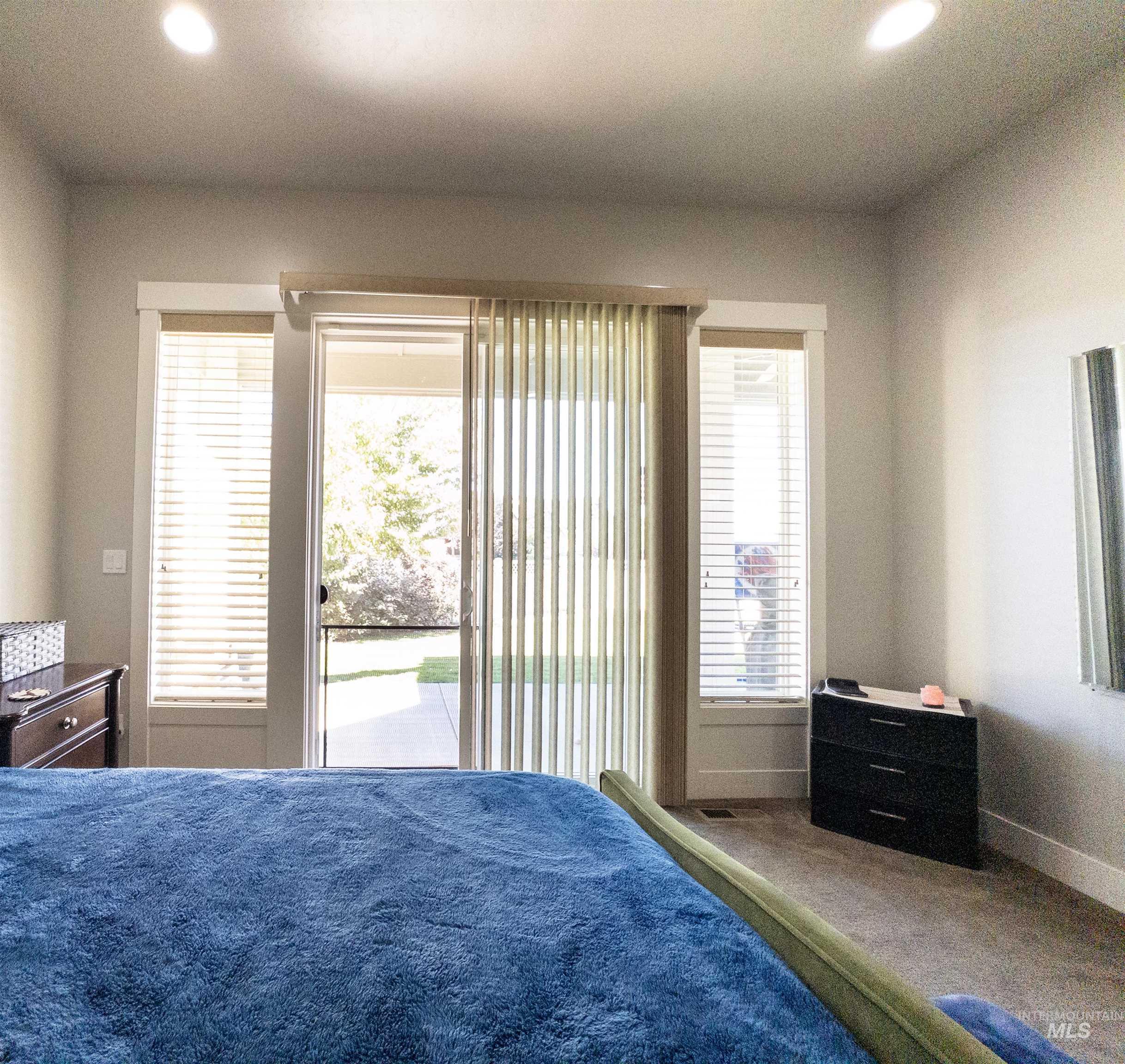 4577 North Comiso Place Meridian, ID 83646 - Photo 23 of 47 Bedroom featuring recessed lighting, access to exterior, and carpet