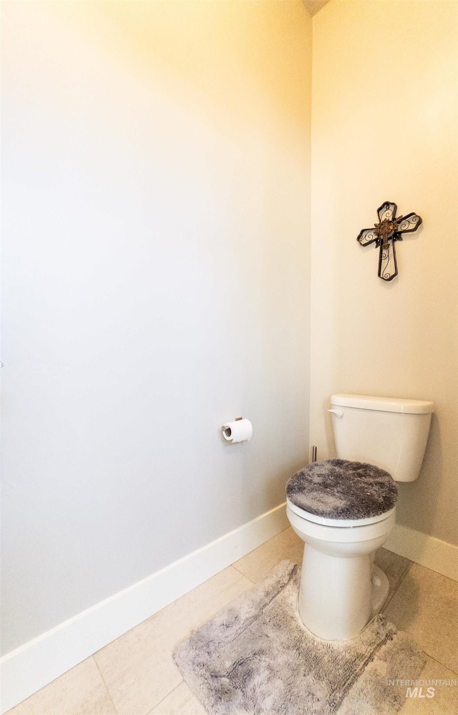 4577 North Comiso Place Meridian, ID 83646 - Photo 28 of 47 Bathroom with baseboards and light tile patterned floors