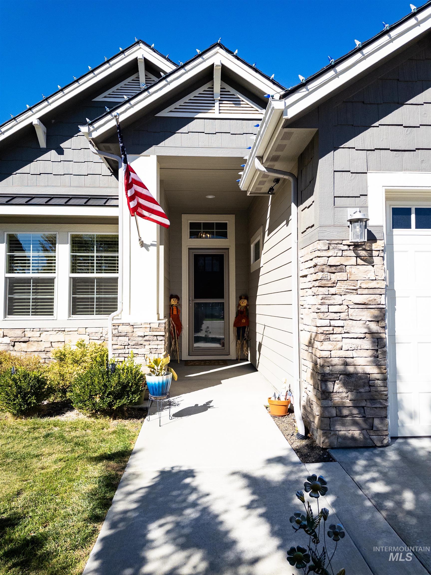 4577 North Comiso Place Meridian, ID 83646 - Photo 3 of 47 View of exterior entry with stone siding
