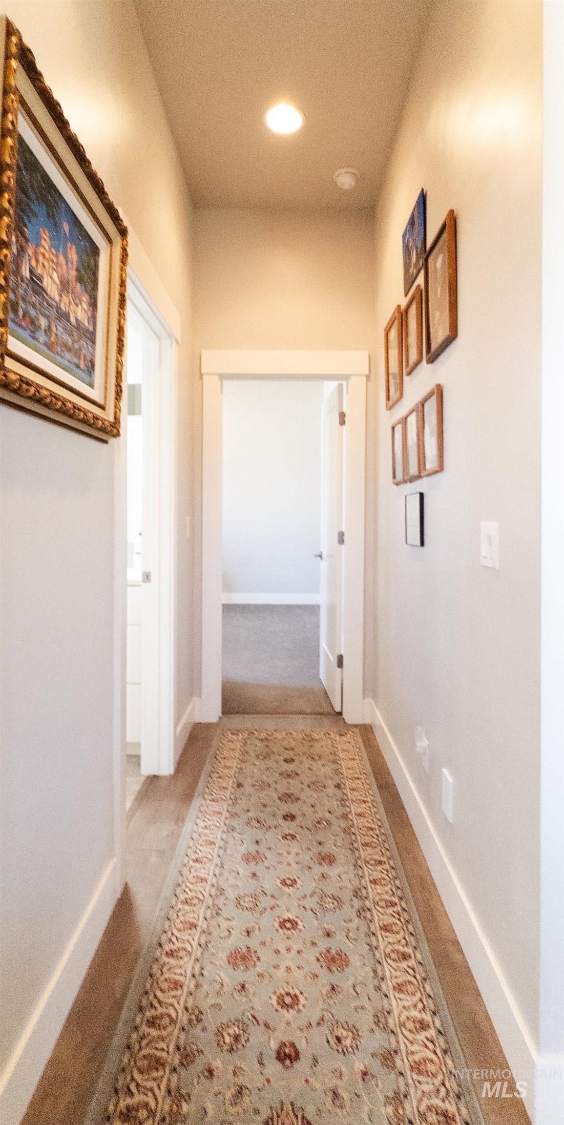 4577 North Comiso Place Meridian, ID 83646 - Photo 32 of 47 Hall with light carpet and recessed lighting