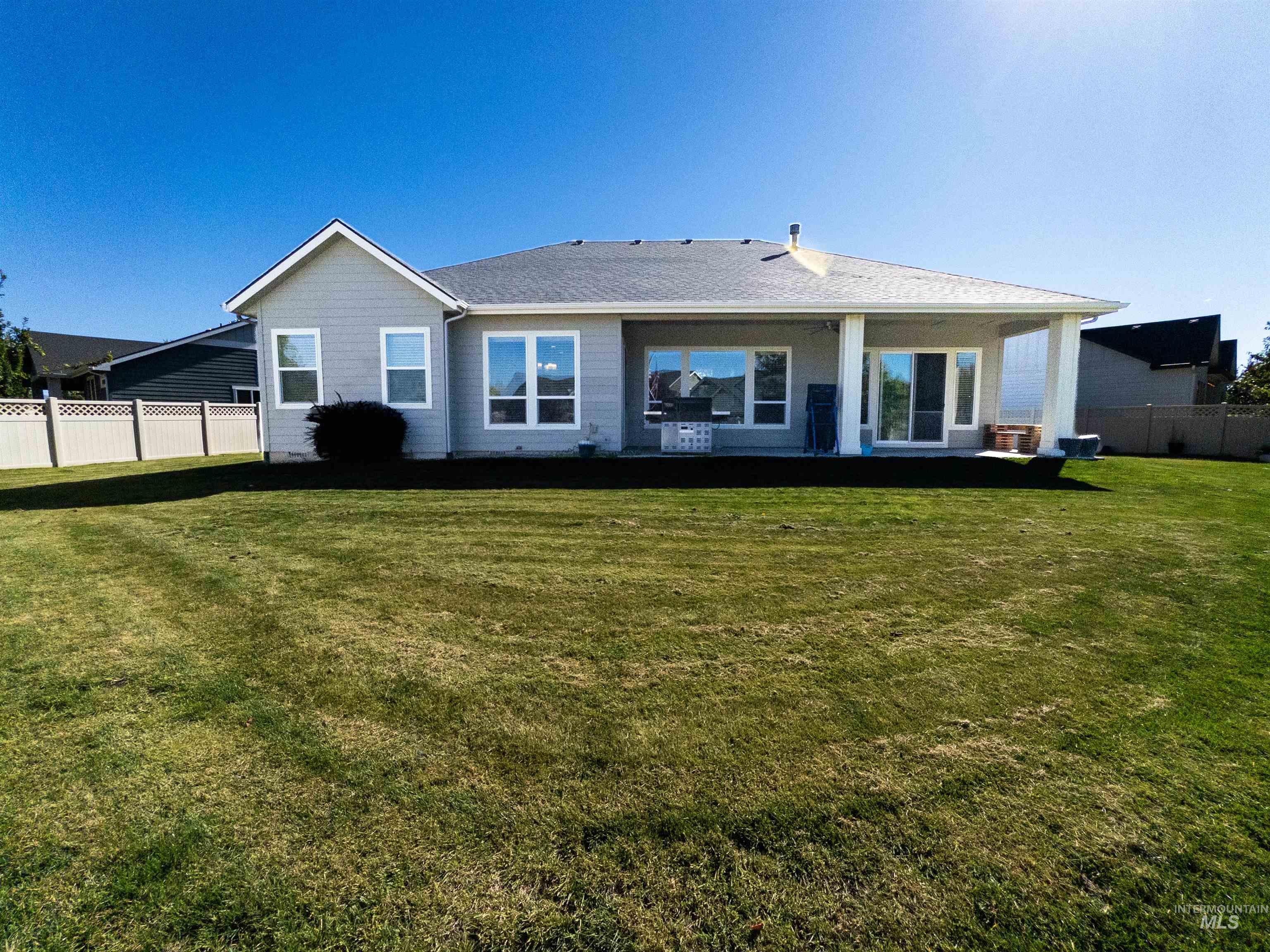 4577 North Comiso Place Meridian, ID 83646 - Photo 39 of 47 Rear view of house featuring a patio area