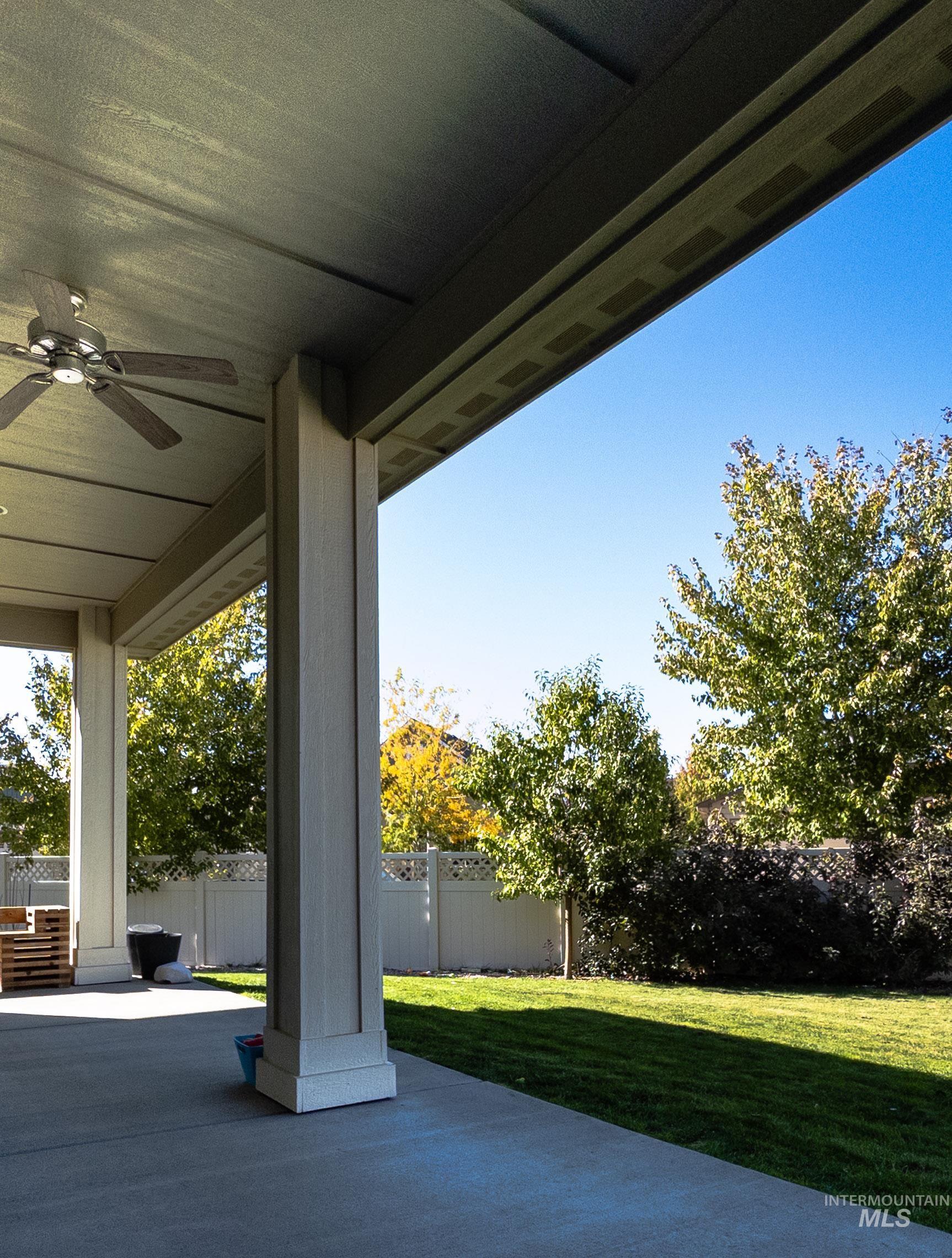 4577 North Comiso Place Meridian, ID 83646 - Photo 40 of 47 Fenced backyard featuring a ceiling fan and a patio area