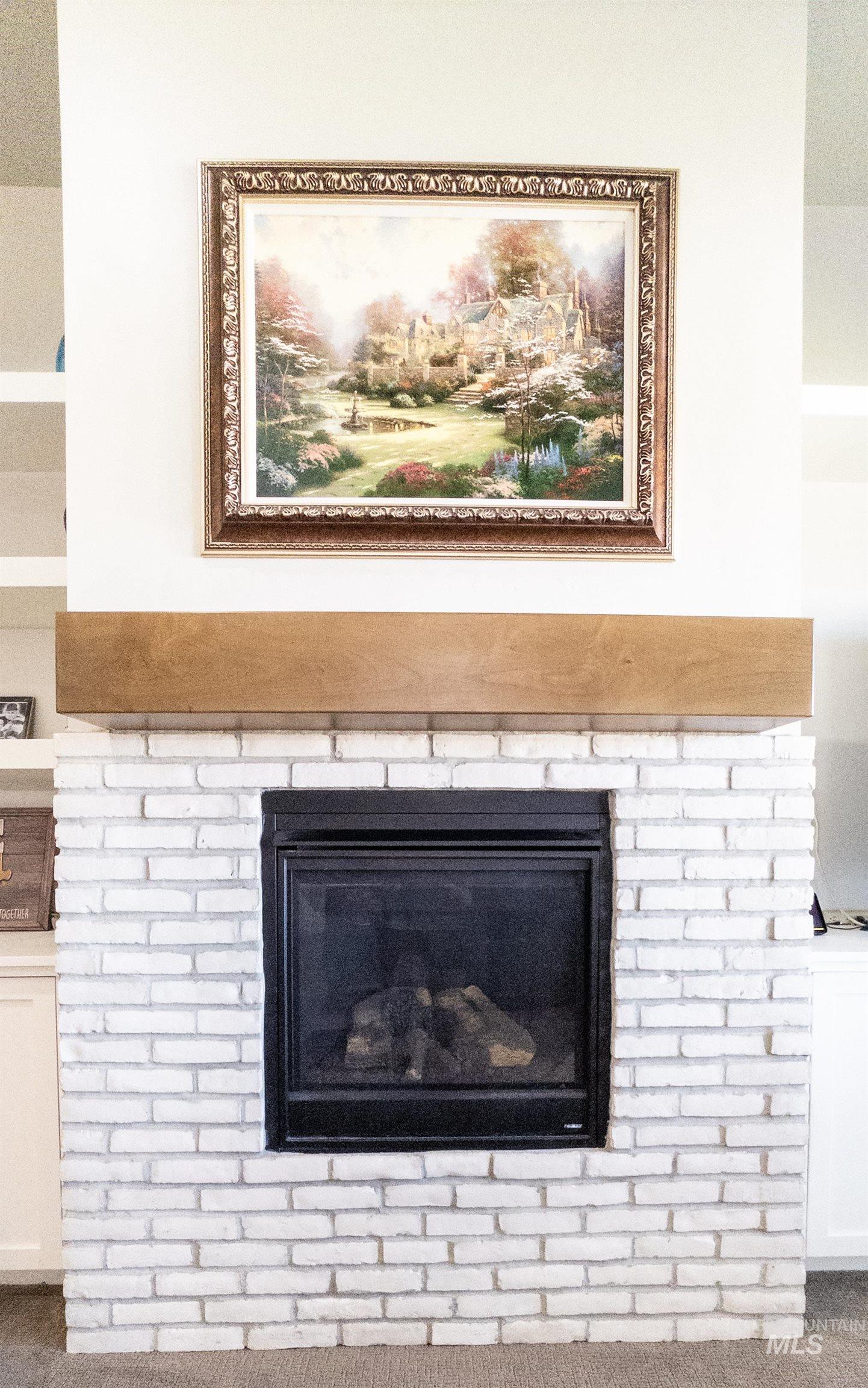 4577 North Comiso Place Meridian, ID 83646 - Photo 7 of 47 Detailed view of carpet flooring and a fireplace