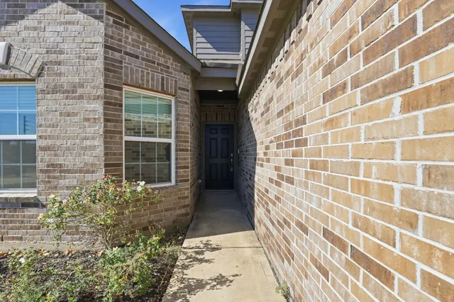 a view of a brick house with a window