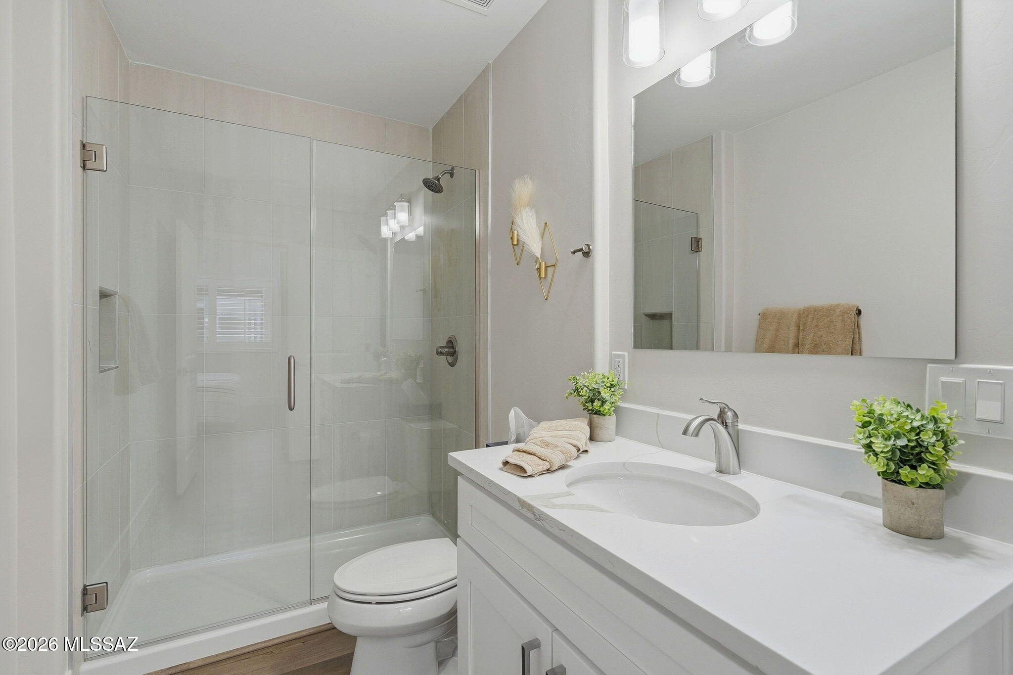 2020 East River Road, Unit 101 Tucson, AZ 85718 - Photo 8 of 12 a bathroom with a sink toilet and shower