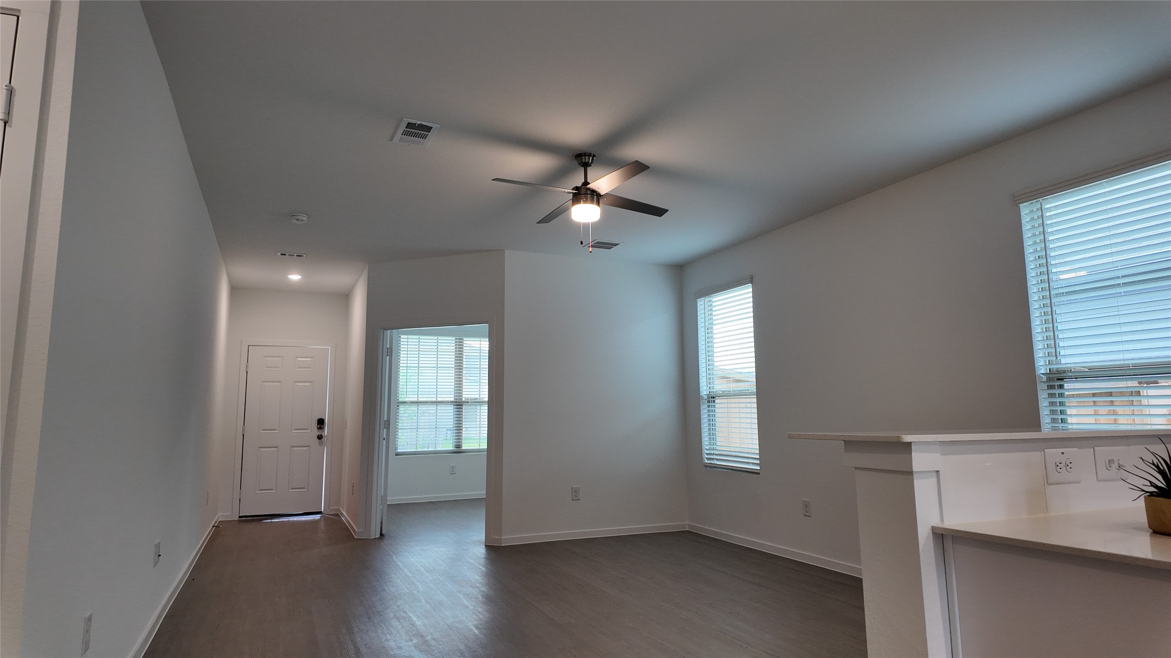 15023 Rustic Moon Road Conroe, TX 77302 - Photo 5 of 18 an empty room with wooden floor and windows