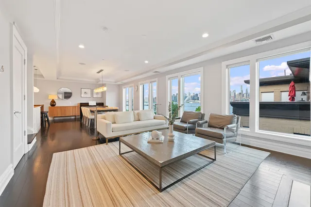 a living room with furniture and a table