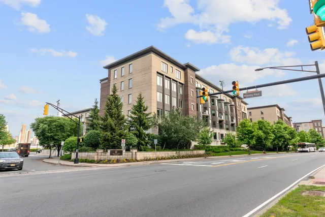a view of a street with a building in the background