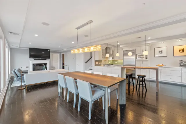 a large kitchen with a table and chairs