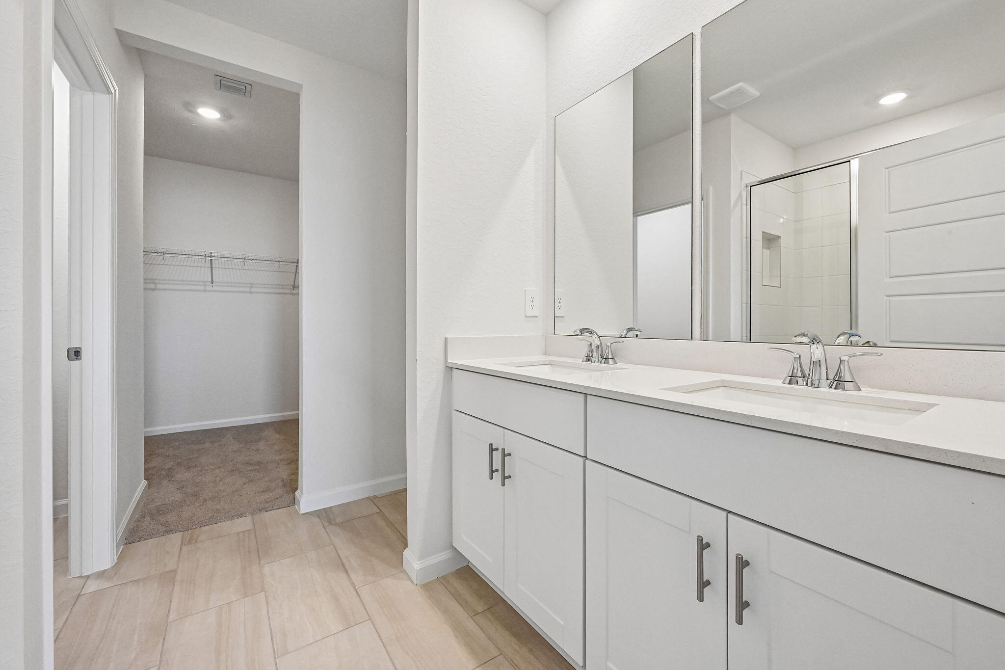 14503 Southwest New Dawn Road Indiantown, FL 34956 - Photo 29 of 42 a bathroom with a double vanity sink and mirror