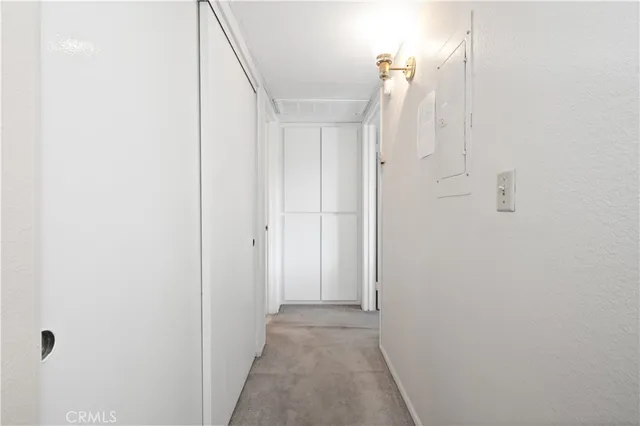 a view of a hallway with white walls