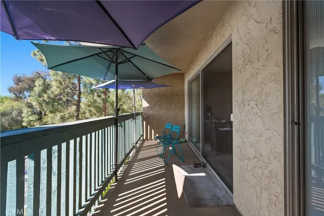 a view of balcony with wooden floor