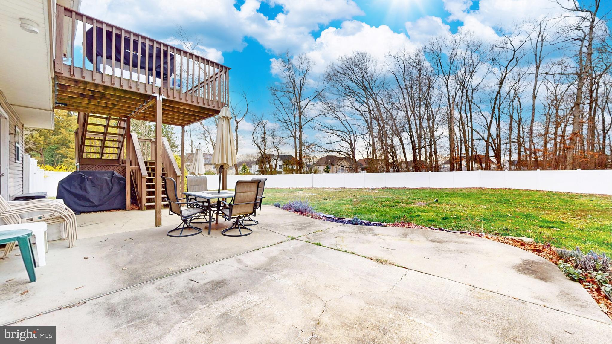 332 Copperfield Drive Williamstown, NJ 08094 - Photo 43 of 46 a view of a patio with a table and chairs