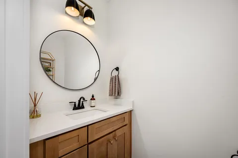 a bathroom with a sink and a mirror