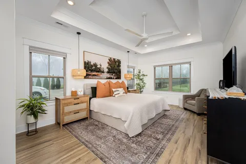 a bedroom with bed and flat screen tv