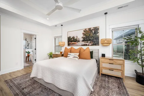 a bedroom with bed and large window