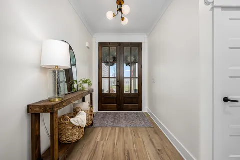 a view of entryway with wooden floor