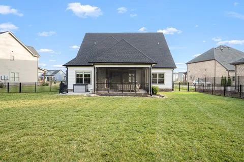 a front view of house with yard and outdoor seating