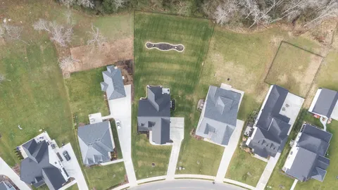 a bathroom with a sink mirror and vanity