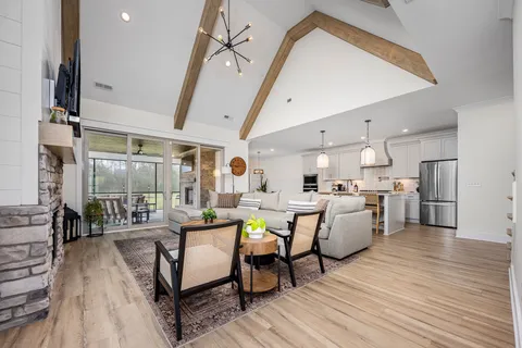 a dining room with furniture and wooden floor