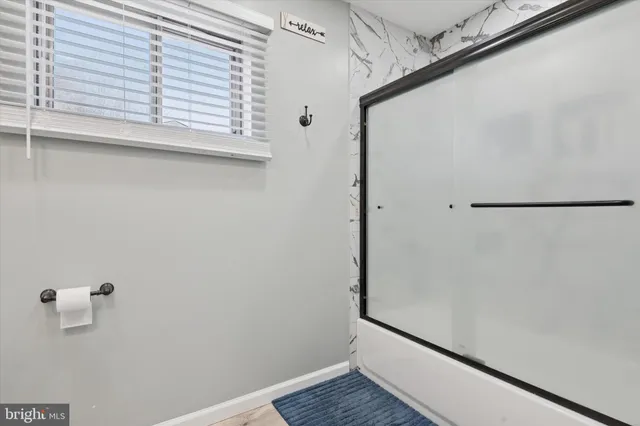 a view of front door with wooden floor