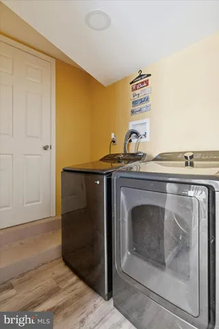 a stove top oven sitting inside of a kitchen