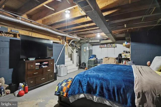 a bed room with a bed and a tv