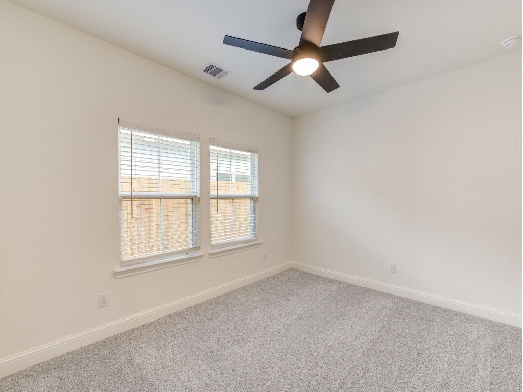 140 County Road 2278 Cleveland, TX 77327 - Photo 7 of 10 an empty room with a window