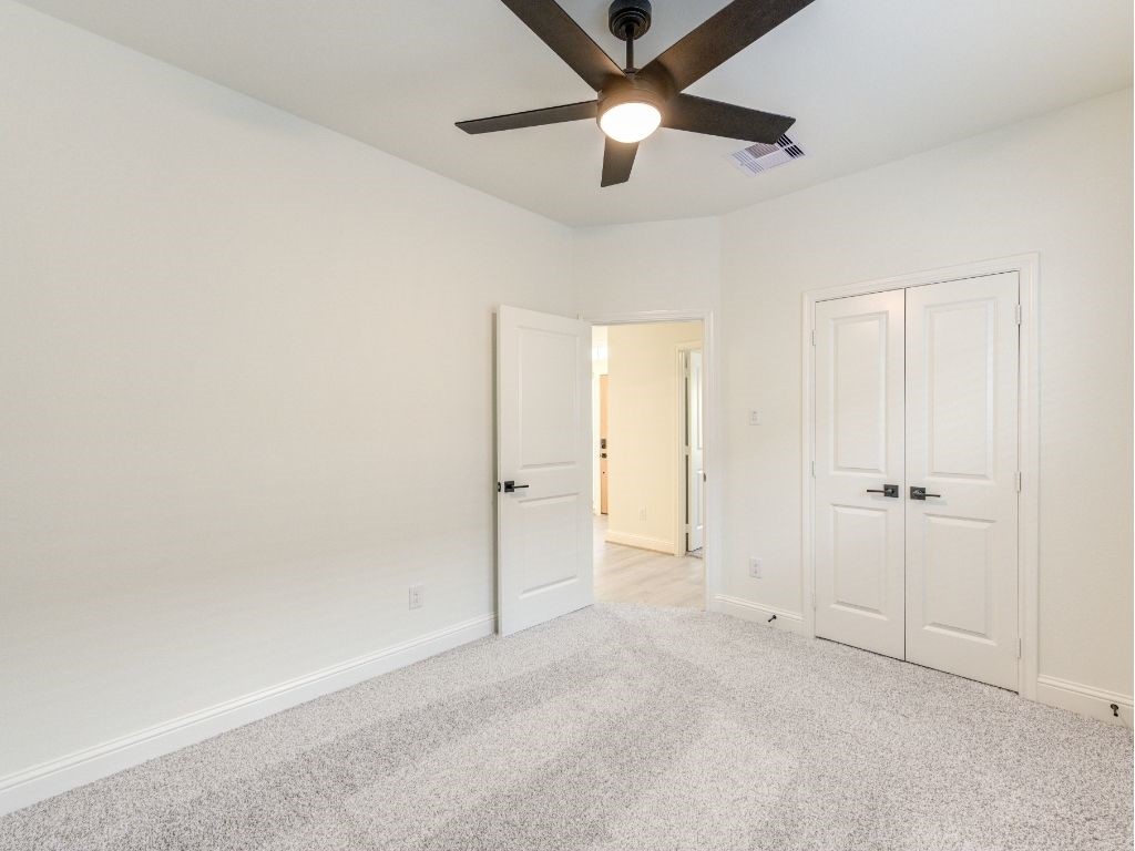 140 County Road 2278 Cleveland, TX 77327 - Photo 9 of 10 an empty room with closet and fan