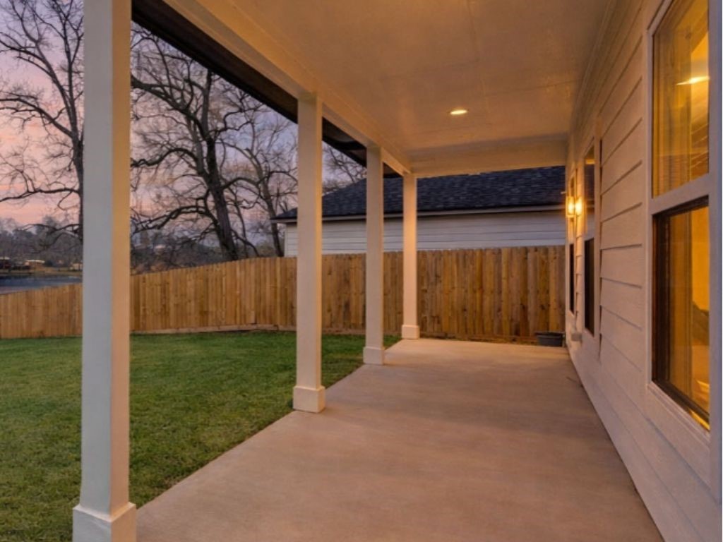 140 County Road 2278 Cleveland, TX 77327 - Photo 10 of 10 a view of a back yard with a wooden fence