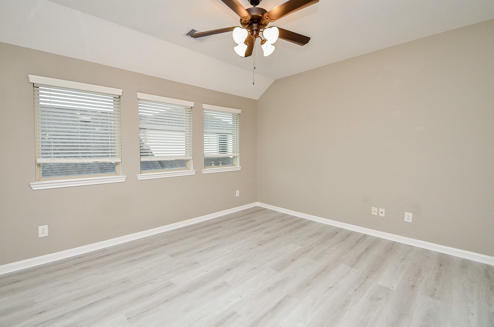 1510 Kent Valley Lane Rosenberg, TX 77471 - Photo 20 of 33 a view of an empty room with window and wooden floor