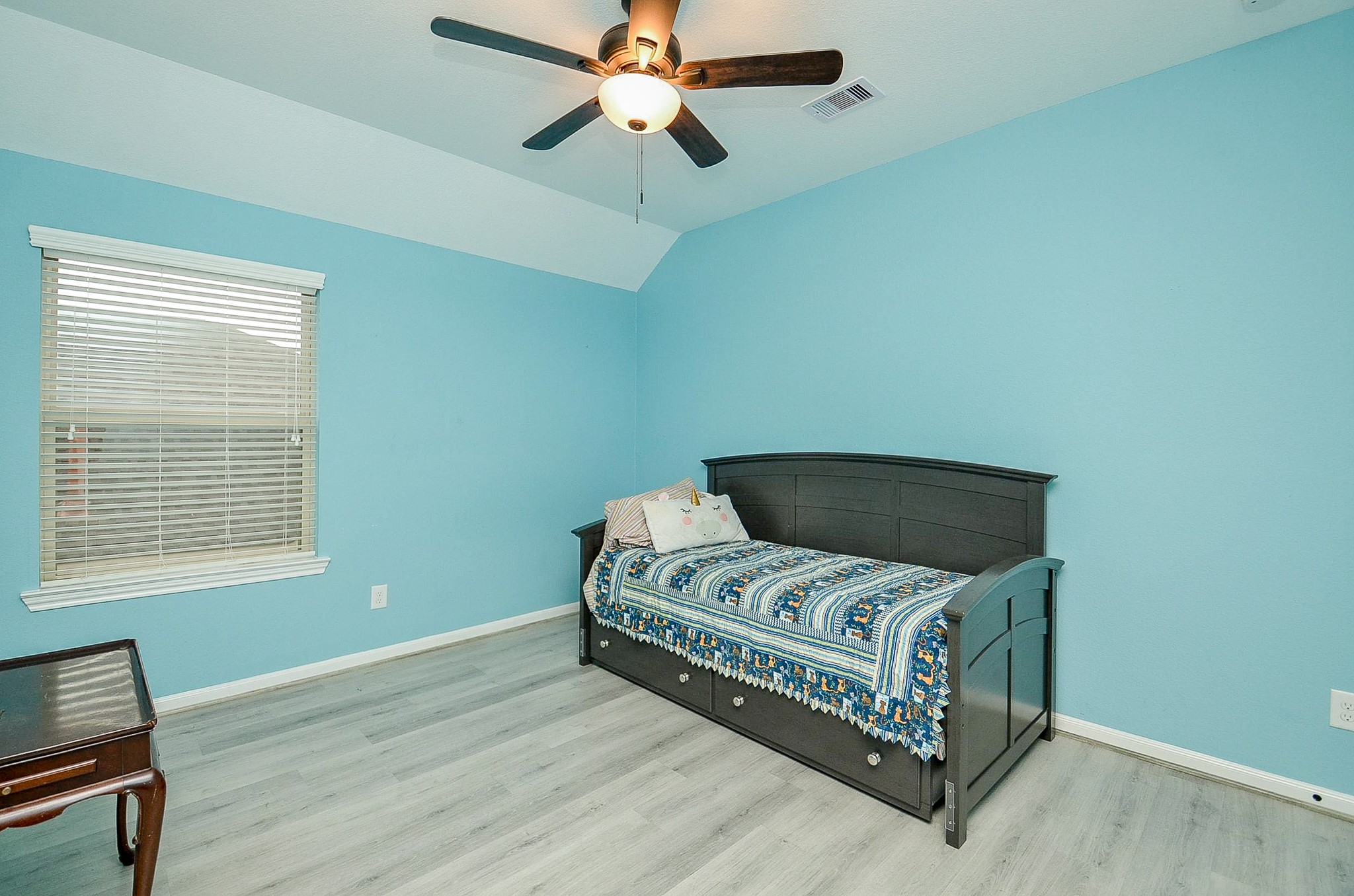 1510 Kent Valley Lane Rosenberg, TX 77471 - Photo 26 of 33 a bedroom with a bed and a chandelier