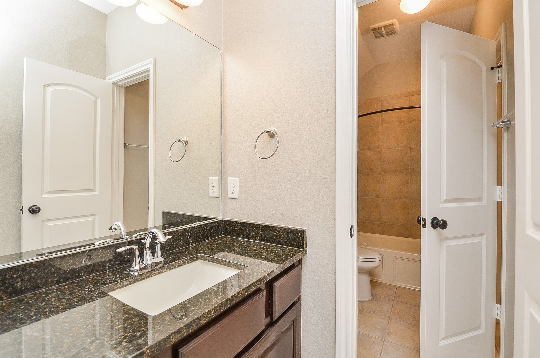 1510 Kent Valley Lane Rosenberg, TX 77471 - Photo 29 of 33 a bathroom with a granite countertop sink and a mirror