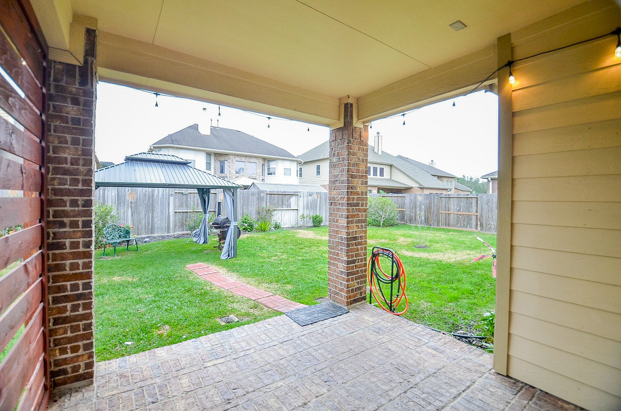 1510 Kent Valley Lane Rosenberg, TX 77471 - Photo 31 of 33 a view of a house with a yard and a garden